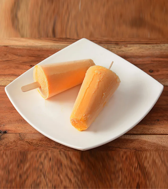 Kesar kulfi served on a white plate